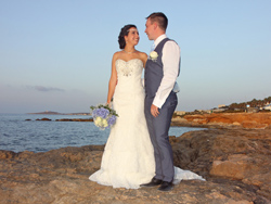 The bride and groom having some time alone before sunset