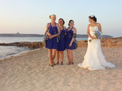 Angie and the bridesmaids having some fun on the sandy beach