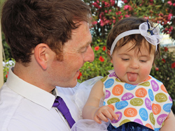 The lovely flowergirl with her father