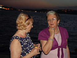 Kathleen and Shane Wedding - Guests ejoying a drink during sunset