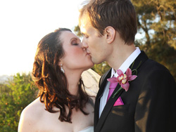 Bride and Groom kissing while enjoying the sunset in Malta