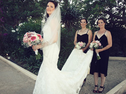 The bride posing with her bridesmaids