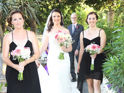 The bride walking in the garden wedding venue to the civil wedding area